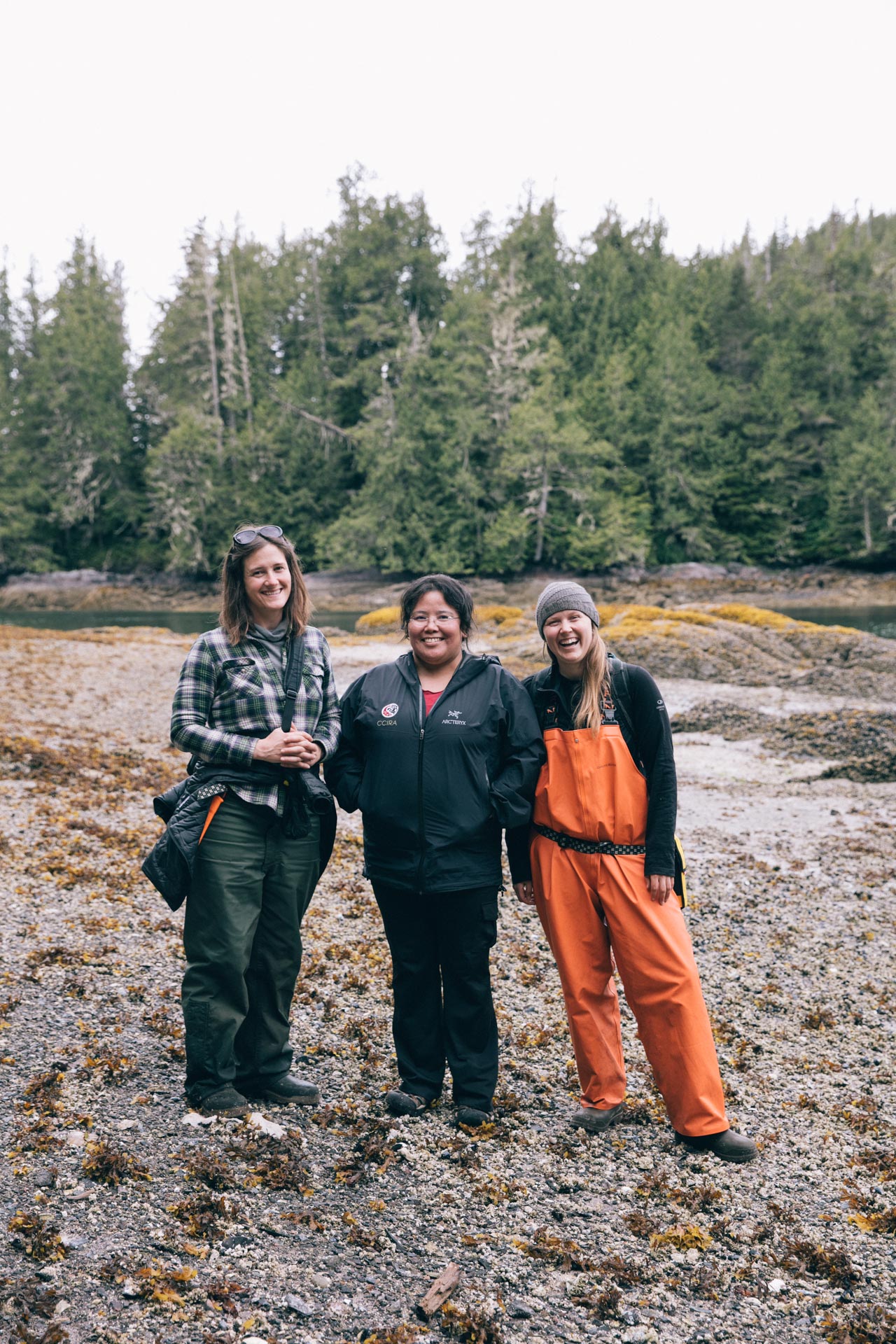 University of Victoria researcher Megan S. Adams (right), Wuikinuxv Nation researcher Jennifer Walkus (center), and Raincoast Conservation researcher Scott Rogers (left) on site in the Great Bear Rainforest of the Coastal First Nations and British Columbia, Canada. (Photo courtesy of Jeremy Koreski/The Sea to Cedar Initiative; reprinted with permission)