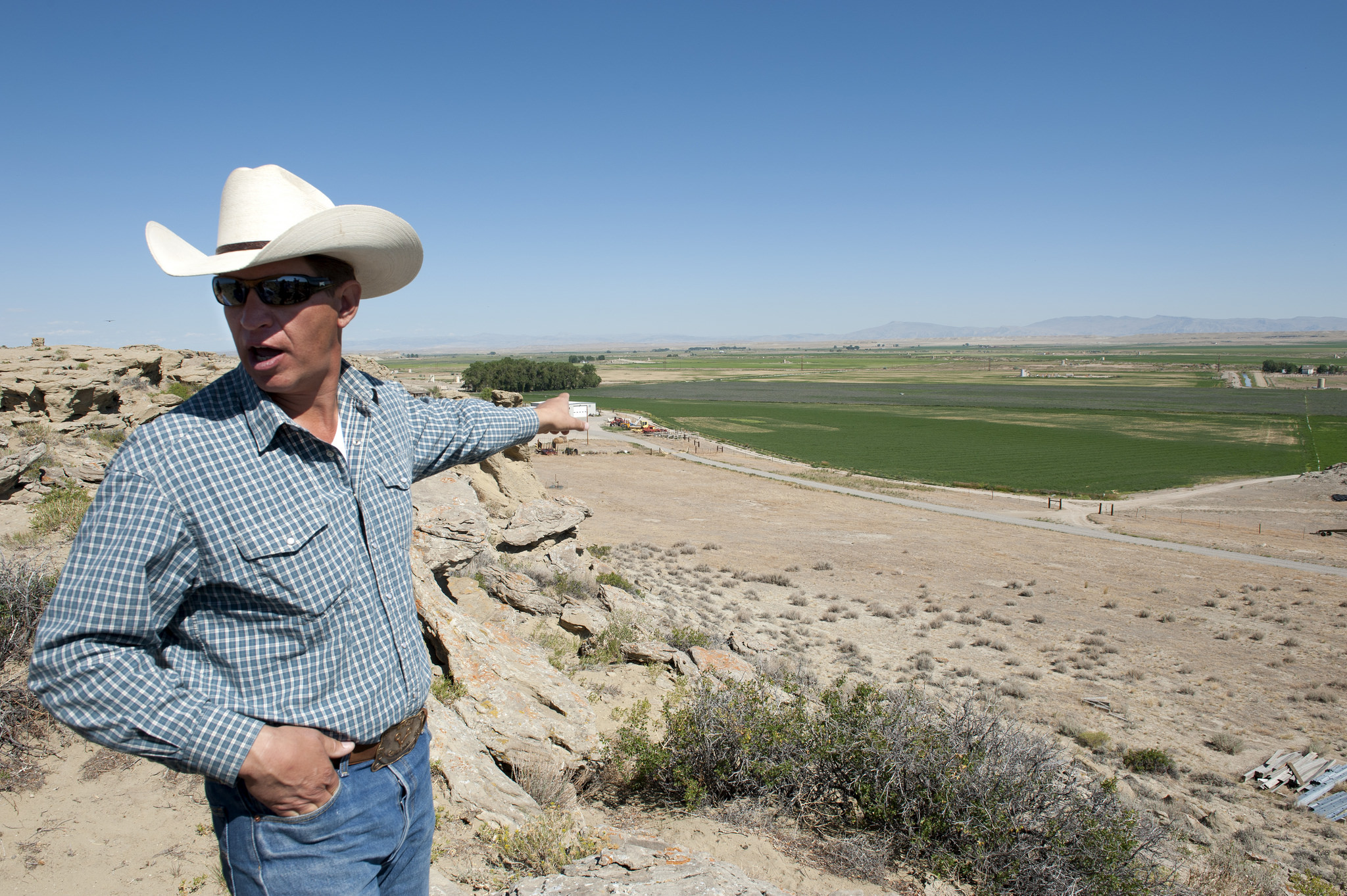 John Fenton, a farmer in Pavillion, points out farms and gas development sites. Photo courtesy of Coming Clean. 
