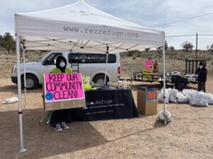 Protest sign reads "Keep Our Community Clean"