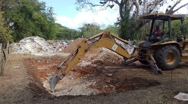 Image of a backhoe digging a hole for cold storage facility