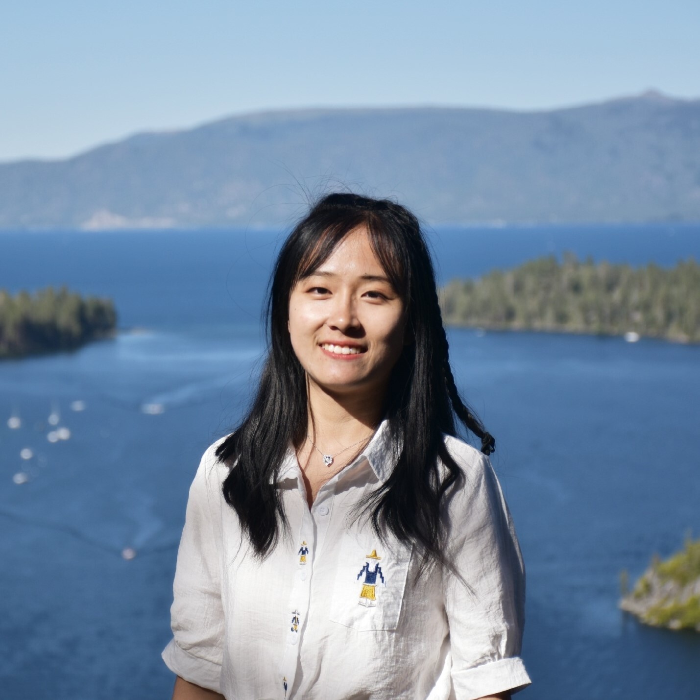 Emma Liu standing in front of background of a lake