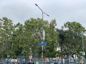 Urban street corner with sign reading Leimert Park